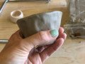 newly moulded clay bowl in hand