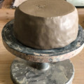 manual pottery wheel and clay bowl